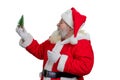 Santa Claus holding little Christmas tree. Royalty Free Stock Photo