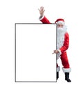 Santa Claus is holding and pointing the white blank sign for seasonal promotion sale and announcement board advertisement isolated Royalty Free Stock Photo