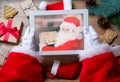 Santa Claus holding tablet device Royalty Free Stock Photo