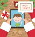 Santa claus is holding tablet and having conversation with young kid and a letter for santa in comic cloud