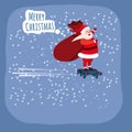 Santa Claus on a hoverboard flies with a bag of gifts around the Earth. Congratulations on a Merry Christmas and Happy