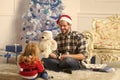 Santa claus kid and bearded man at Christmas tree. Royalty Free Stock Photo