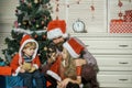 Santa claus kid, bearded man at Christmas tree. Royalty Free Stock Photo