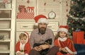 Santa claus kid, bearded man at Christmas tree Royalty Free Stock Photo