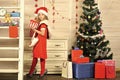 Santa claus kid at Christmas tree. Royalty Free Stock Photo