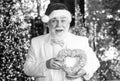 Santa Claus. Kind grandpa with heart. Christmas decoration. Christmas eve. Lovely greetings. Senior man celebrate