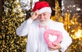 Santa Claus. Kind grandpa with heart. Christmas decoration. Love and care. Mature man with white beard. Charity and