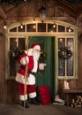 Santa Claus knocking in door Royalty Free Stock Photo