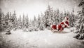 Santa Claus with a lantern and sack of presents on the sled with a blurred snowy winter Christmas day background. Royalty Free Stock Photo