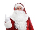 Santa Claus listening to Christmas music on white Royalty Free Stock Photo