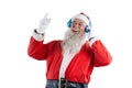 Santa claus listening to music on headphones Royalty Free Stock Photo