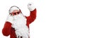 Santa Claus listening to music with headphones on background. Banner design Royalty Free Stock Photo