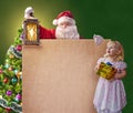 Santa Claus with a little girl, vintage lantern and a poster Royalty Free Stock Photo