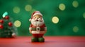 Santa Claus made by clay on green and red blur background for Christmas wallpaper background with text space.