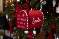 Santa Claus mailbox and gift with bow and ribbons.