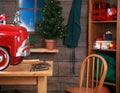 Santa Claus makes a Pedal Car in his Workshop for a Lucky little boy or girl for Christmas Royalty Free Stock Photo