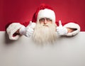 Santa claus making the ok sign on top of billboard Royalty Free Stock Photo