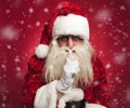 Santa claus making the quiet gesture Royalty Free Stock Photo