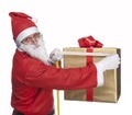 Santa Claus measuring a gift box Royalty Free Stock Photo