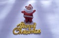 Santa Claus with a Merry Christmas gold text is isolated on a white background or snow background Royalty Free Stock Photo