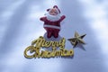 Santa Claus with a Merry Christmas gold text is isolated on a white background or snow background Royalty Free Stock Photo