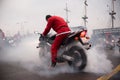 Santa Claus on Motorcycle Performing Burnout at Christmas Parade Royalty Free Stock Photo