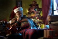 Santa Claus napping on his armchair Royalty Free Stock Photo