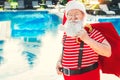 Santa Claus near the pool holiday vacation concept Royalty Free Stock Photo