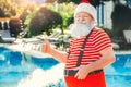 Santa Claus near the pool holiday vacation concept Royalty Free Stock Photo