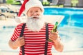 Santa Claus near the pool holiday vacation concept Royalty Free Stock Photo