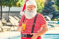 Santa Claus near the pool holiday vacation concept Royalty Free Stock Photo