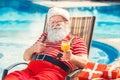 Santa Claus near the pool holiday vacation concept Royalty Free Stock Photo