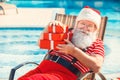 Santa Claus near the pool holiday vacation concept Royalty Free Stock Photo