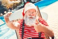 Santa Claus near the pool holiday vacation concept Royalty Free Stock Photo