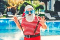 Santa Claus near the pool holiday vacation concept Royalty Free Stock Photo