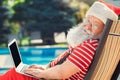 Santa Claus near the pool holiday vacation concept Royalty Free Stock Photo