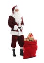 Santa Claus near sack of gifts on white background Royalty Free Stock Photo