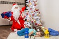 Santa Claus in New Years Eve was surprised seeing the tree two sleeping children Royalty Free Stock Photo