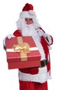 Santa claus is offering a big gift box Royalty Free Stock Photo