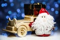 Santa Claus and old retro wooden car with gift box Royalty Free Stock Photo