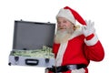 Santa Claus with open case full of money. Royalty Free Stock Photo