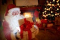 Santa Claus opening a magic gift box Royalty Free Stock Photo