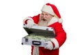 Santa Claus opening suitcase with money. Royalty Free Stock Photo