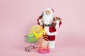 Santa Claus pink shopping trolley with rainbow