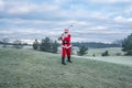 Santa Claus  playing golf on the winter golf course Royalty Free Stock Photo