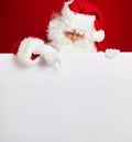 Santa Claus pointing in blank advertisement banner isolated on r