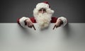 Santa Claus pointing at blank sign Royalty Free Stock Photo