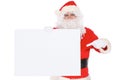 Santa Claus pointing on blank white wall, advertisement banner with copy space. Isolated on white background Royalty Free Stock Photo