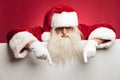 Santa claus is pointing down to blank billboard Royalty Free Stock Photo