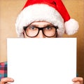 Santa Claus pointing in white blank sign Royalty Free Stock Photo